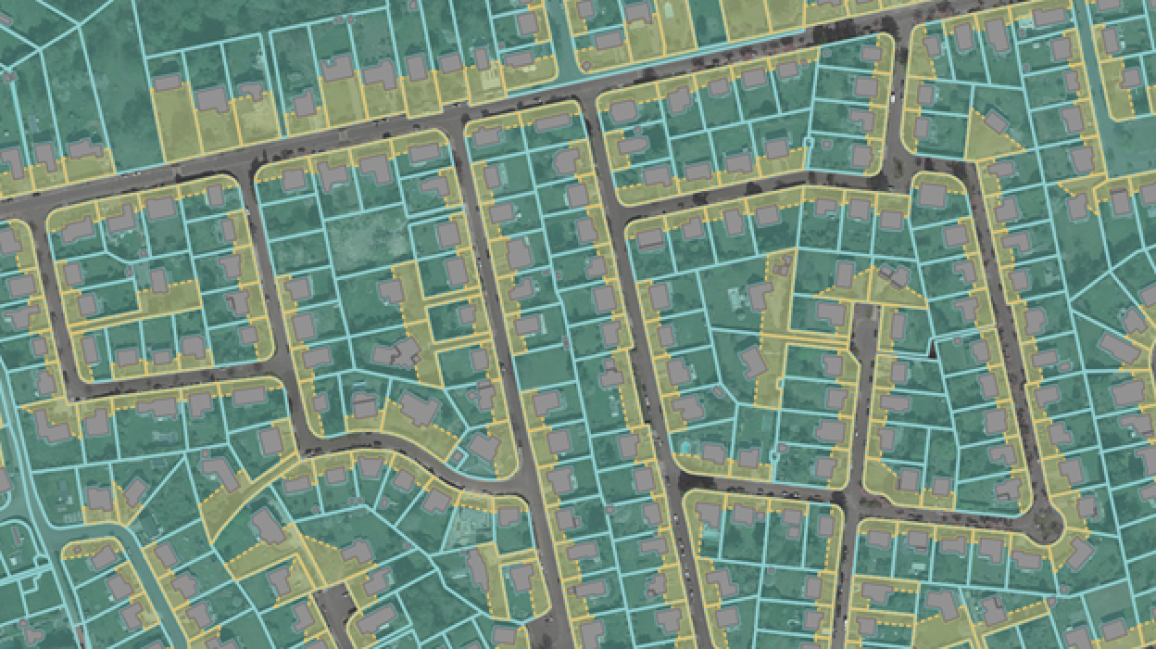 Figure 1: Delineation of front yards in Belmap: Front yards (yellow areas) are the portion of the plot (green lines) located between the building and its associated streets.